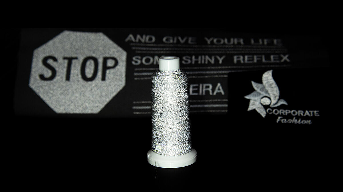 Cone of Reflect thread and examples of embroideries