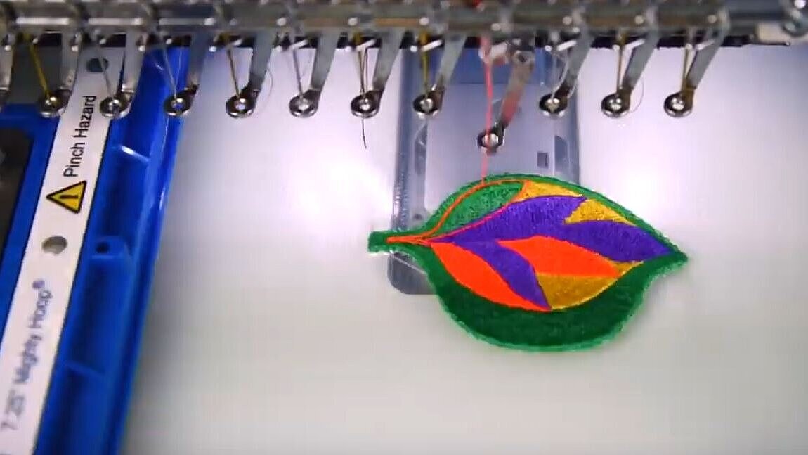 Patch being embroiders on heatsoluble film on an embroidery machine