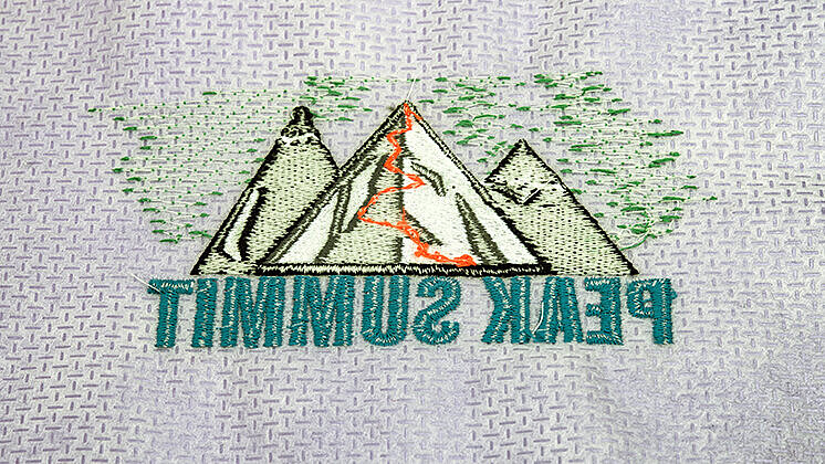 Back side of an embroidery with understitches and backing