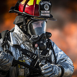 Fire fighter in protection clothing