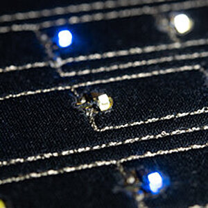 embroidered textile circuitry with conductive thread