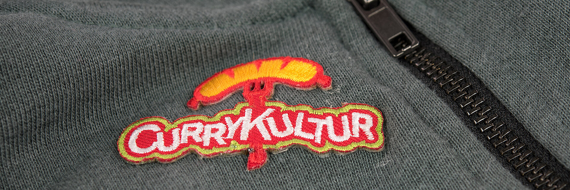 [Translate to Hongkong (Englisch):] embroidered fast food logo "Currykultur"