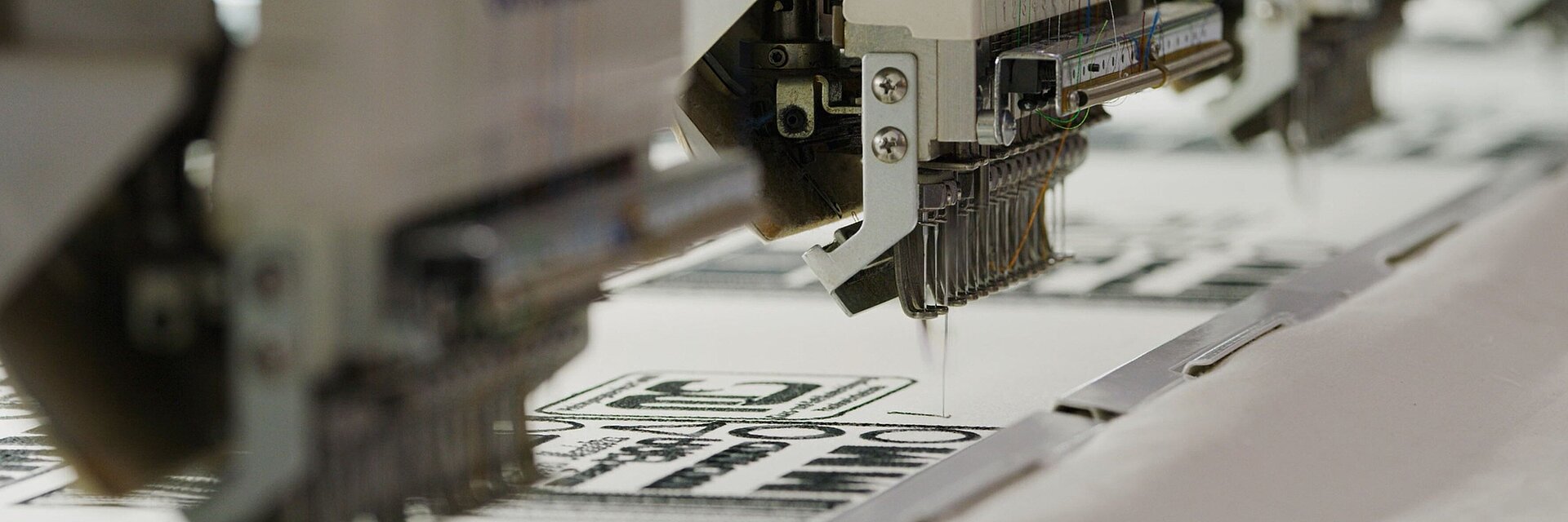 image showing an industrial embroidery machine in action