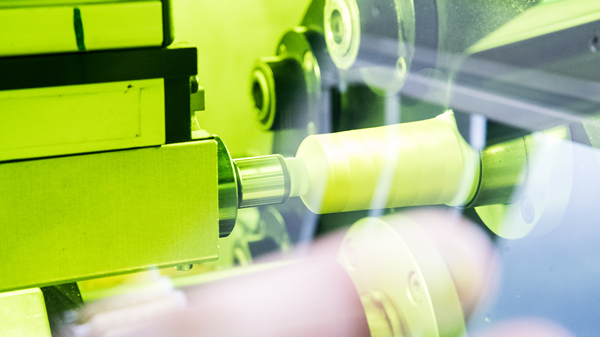Madeira thread production showing a high performance spooling machine