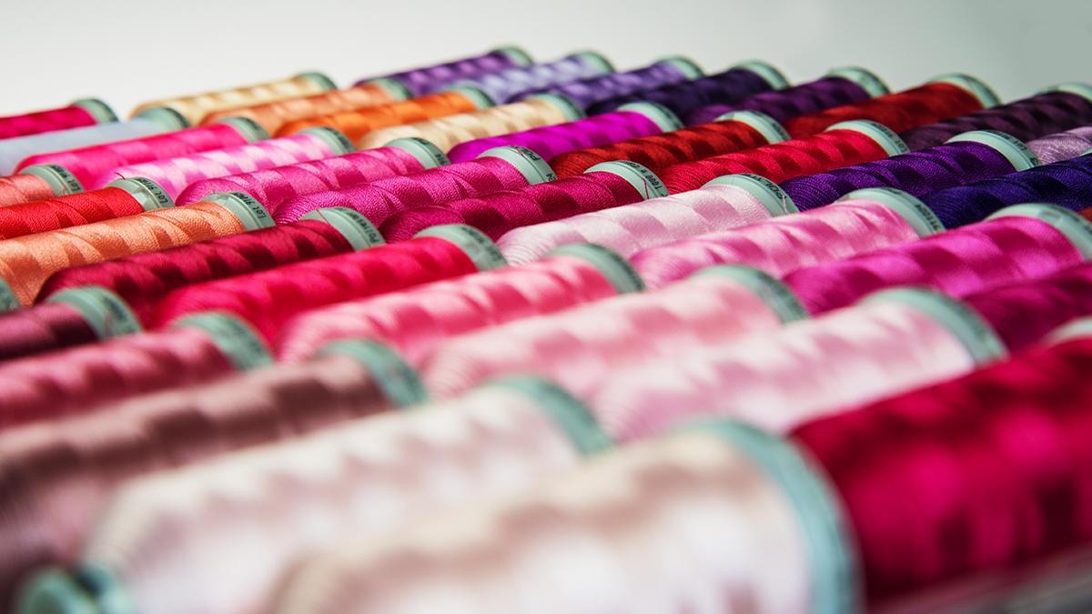 close up of Madeira polyester thread in a wood assortment box
